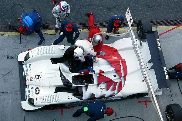 Andy Wallace (GBR) climbs into the winning RN Motorsports DBA4-03S Zytek during a pit stop