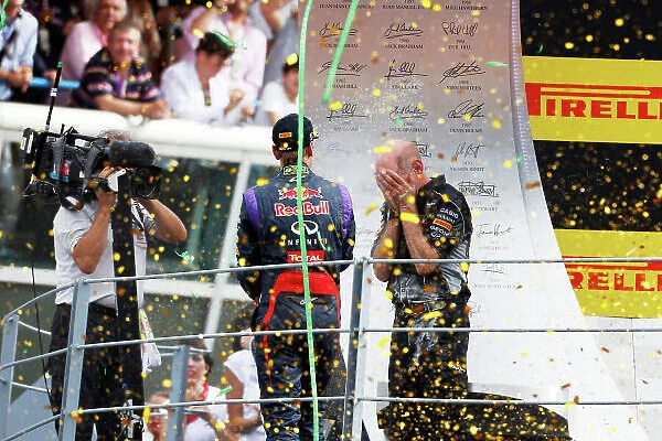 Autodromo Nazionale di Monza, Monza, Italy. 8th September 2013. Sebastian Vettel, Red Bull Racing, 1st position, sprays Champagne at Adrian Newey, Chief Technical Officer, Red Bull Racing