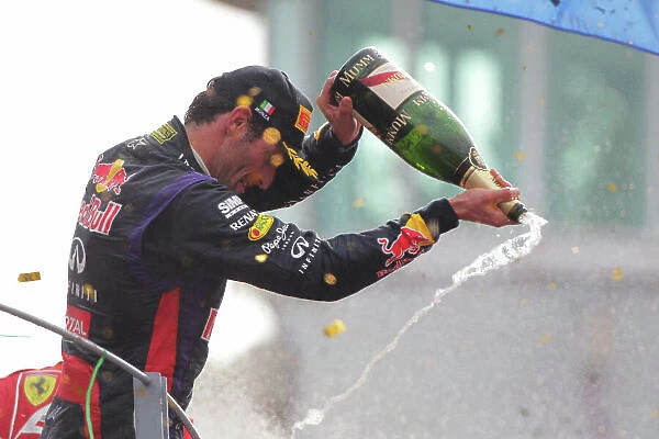 Autodromo Nazionale di Monza, Monza, Italy. 8th September 2013. Mark Webber, Red Bull Racing, 3rd position, pours Champagne from the podium. World Copyright: Andy Hone / LAT Photographic. ref: Digital Image HONY8406