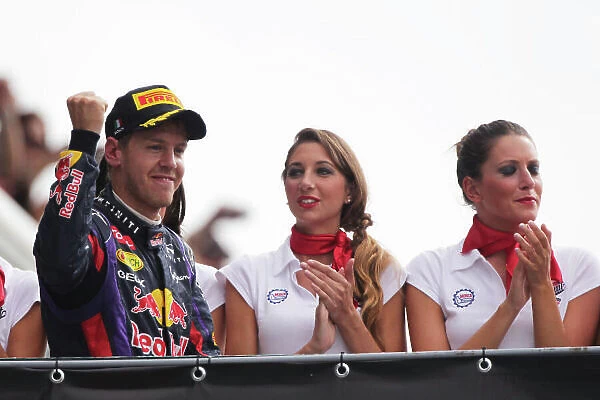 Autodromo Nazionale di Monza, Monza, Italy. 8th September 2013. Sebastian Vettel, Red Bull Racing, 1st position, arrives on the podium. World Copyright: Andy Hone / LAT Photographic. ref: Digital Image HONY8173