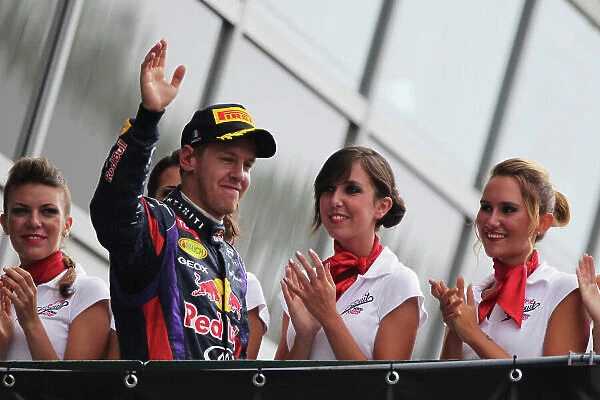 Autodromo Nazionale di Monza, Monza, Italy. 8th September 2013. Sebastian Vettel, Red Bull Racing, 1st position, arrives on the podium. World Copyright: Andy Hone / LAT Photographic. ref: Digital Image HONY8163
