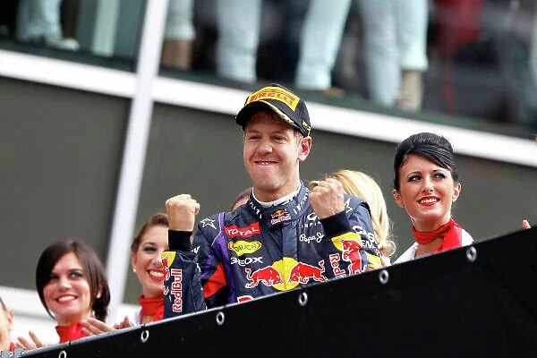 Autodromo Nazionale di Monza, Monza, Italy. 8th September 2013. Sebastian Vettel, Red Bull Racing, 1st position, arrives on the podium. World Copyright: Glenn Dunbar / LAT Photographic. ref: Digital Image _G7C8996