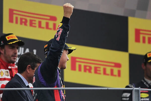 Autodromo Nazionale di Monza, Monza, Italy. 8th September 2013. Sebastian Vettel, Red Bull Racing, 1st position, celebrates on the podium. World Copyright: Andy Hone / LAT Photographic. ref: Digital Image HONY8213