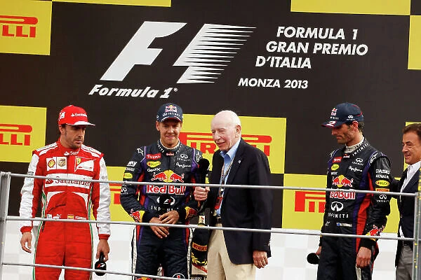 Autodromo Nazionale di Monza, Monza, Italy. 8th September 2013. John Surtees on the podium to interview Fernando Alonso, Ferrari, 2nd position, Sebastian Vettel, Red Bull Racing, 1st position, and Mark Webber, Red Bull Racing