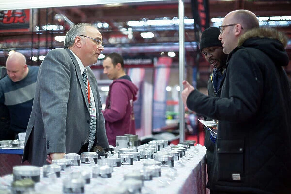 Autosport International Exhibition. National Exhibition Centre, Birmingham, UK. Thursday 14 January 2016. Visitors talk about pistons. World Copyright: Sam Bloxham / LAT Photographic. ref: Digital Image _SBL6050