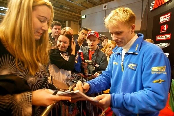Autosport International Show: 2003 World Rally Champion Petter Solberg SUbaru, signs autographs for the fans