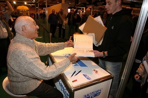 Autosport International Show: Former F1 commentator Murray Walker signs books for the crowd