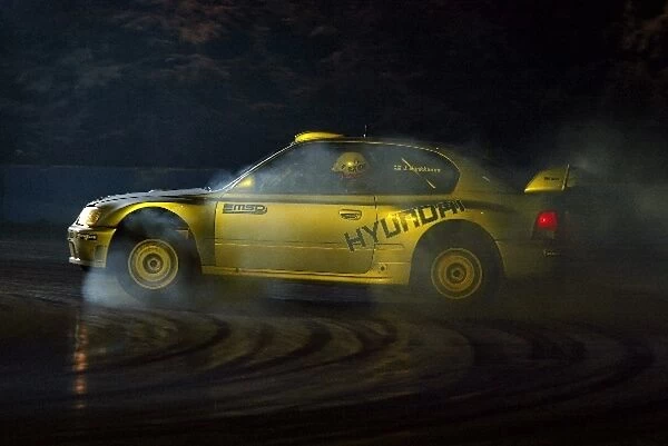 Autosport International Show: Smoke pours off his tyres as Juha Kankkunen gets sideways in his Hyundai Accent WRC