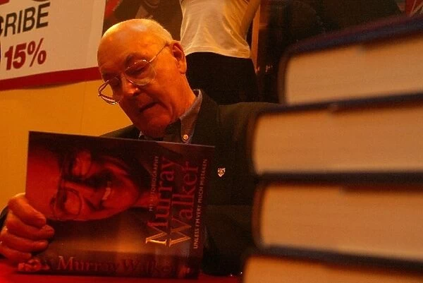 Autosport International Show: TV Legend Murray Walker signs copies of his autobiography on the F1 Racing stand