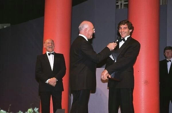 Ayrton Senna receives his award from Murray Walker in 1991 Formula One World Championship World LAT Photogarphic Tel: +44 (0) 181 251 3000 Fax: +44 (0) 181 251 3001 Somerset House, Somerset Road, Teddington, TW11 8RU