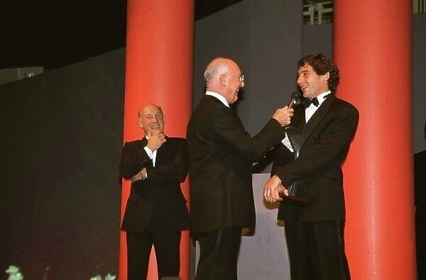 Ayrton Senna receives his award from Murray Walker in 1991 Formula One World Championship World LAT Photogarphic Tel: +44 (0) 181 251 3000 Fax: +44 (0) 181 251 3001 Somerset House, Somerset Road, Teddington, TW11 8RU