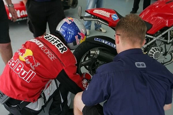 Bahrain F3 Superprix: A motorbike stunt rider had to get help from Carlin to fix a puncture on his bike