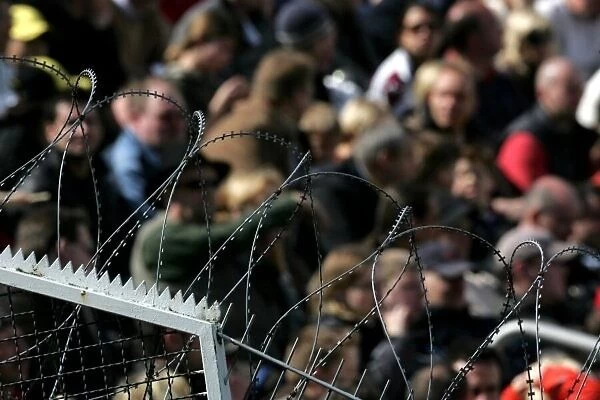 DTM. Barbed wire fencing to keep fans off the track