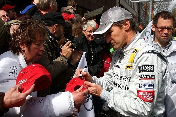 Bernd Schneider (GER) Mercedes Team HWAm, signs autographs for the fans