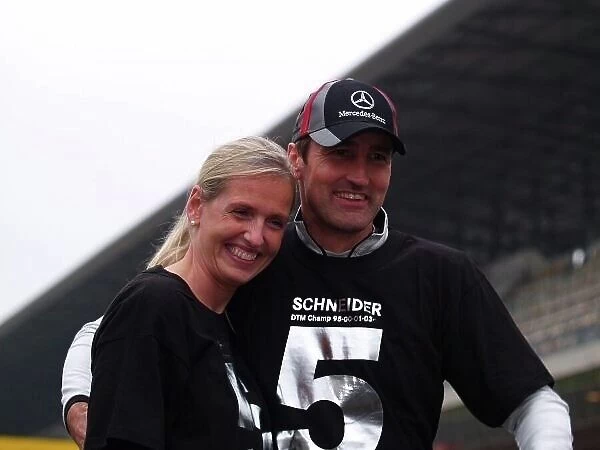 DTM. R-L: Bernd Schneider (GER) Vodafone AMG-Mercedes, with his partner Svenja Weber.