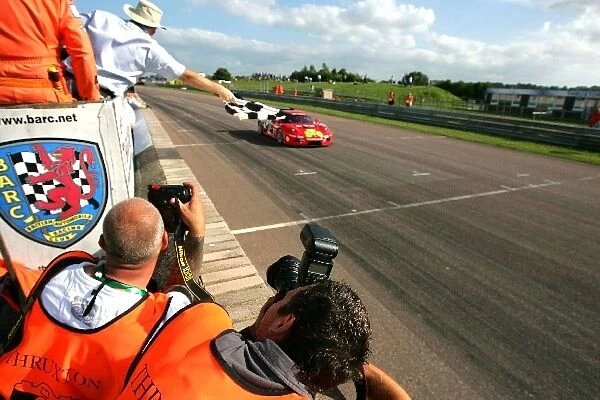 British GT Championship: Allan Simonsen Christians in Motorsort Ferrari F430 GT3 crosses the line to win race 1