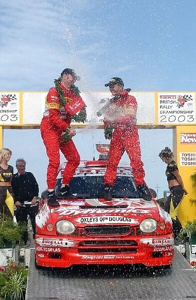 British Rally Championship: Jonny Milner and Nicky Beech celebrate with champagne