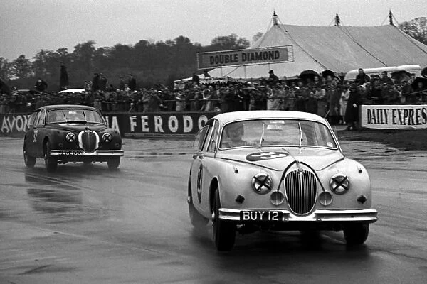 British Saloon Car Racing: Jaguar Mk2Õs race in the wet: British Saloon Car Racing, Silverstone, England, July 1962
