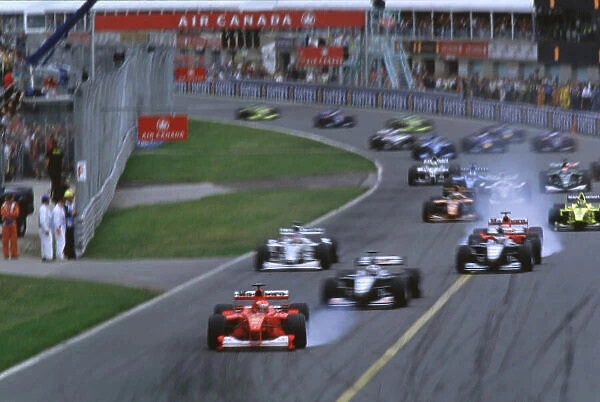 CANADIAN GRAND PRIX 2000 Michael Schumacher, Ferrari leads at the start Montreal, Canada, 18th June 2000 World LAT Photographic Ref: 35mm transparency