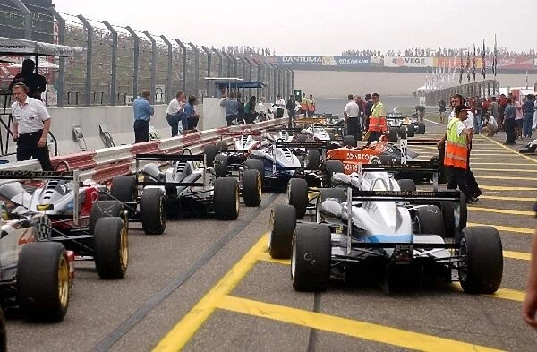 Cars in line at the exit of the pitlane waiting to go out. Marlboro Masters of Formula 3