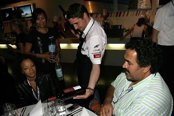 DTM. Christijan Albers (NED) Futurecom-TME Audi, pouring wine for the media guests.