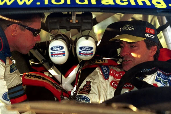 Colin McRae talks to Ford team mate Carlos Sainz. Argentina Rally 2000