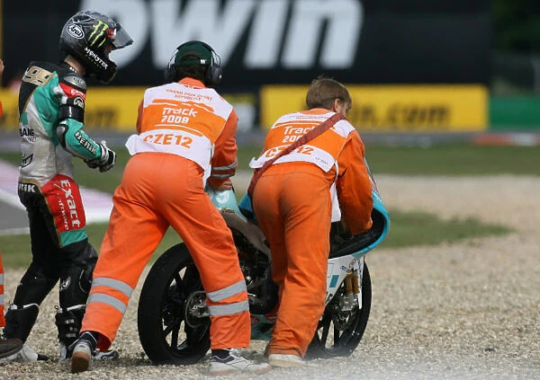 Danny Webb Degraaf Grand Prix Aprilia crashes out on the opening lap of the 125cc race
