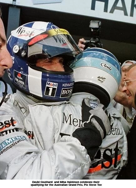 SE 12. David Couthard and Mika Hakkinen celebrate their qualifying for