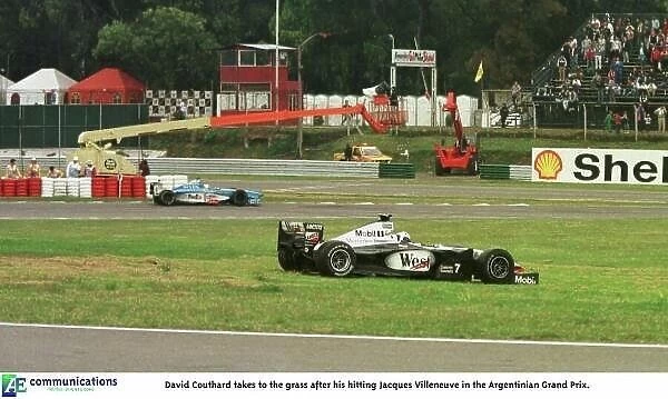 SE 6. David Couthard takes to the grass after his hitting Jacques Villeneuve