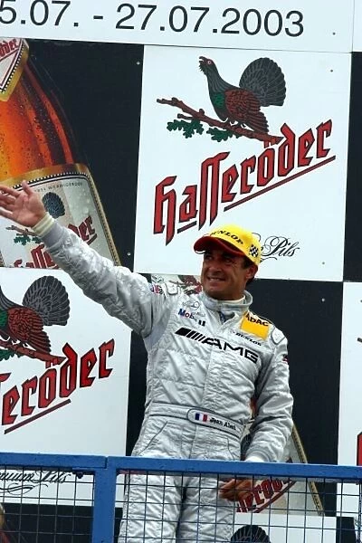 DTM. A delighted Jean Alesi (FRA) AMG-Mercedes takes the top step of the podium.