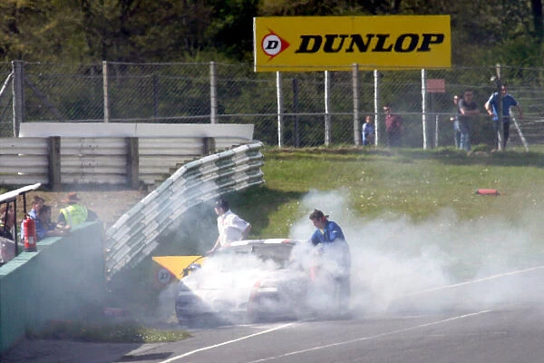 Dominic Lesniewski and Ryan Hookers car is extinguished 2004 British GT