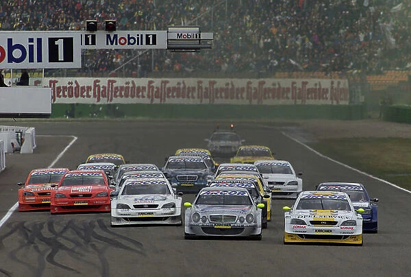 DTM Championship Hockenheim 28th May 2000, Hockenheim, Germany From pole position Bernd Schneider (Mercedes-Benz CLK), centre, leads from Manuedl Reuter and Timo Scheider (both Opel Astra V8 Coup)