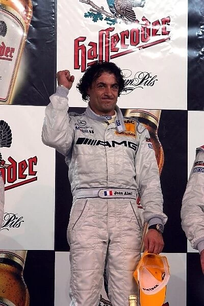 DTM Championship: Race winner Jean Alesi, AMG Mercedes Benz, celebrates on the podium