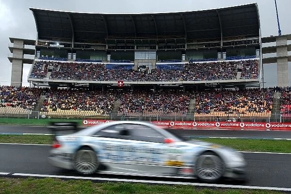 DTM: Christijan Albers, Express-Service AMG Mercedes-Benz CLK-DTM, passing by the new large Soutch grandstand