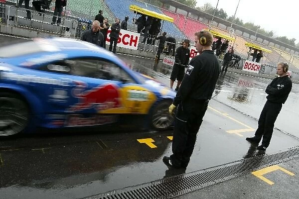 DTM: Karl Wendlinger, PlayStation 2 Red Bull Abt-Audi TT-R, practices a stop in the wet pitlane