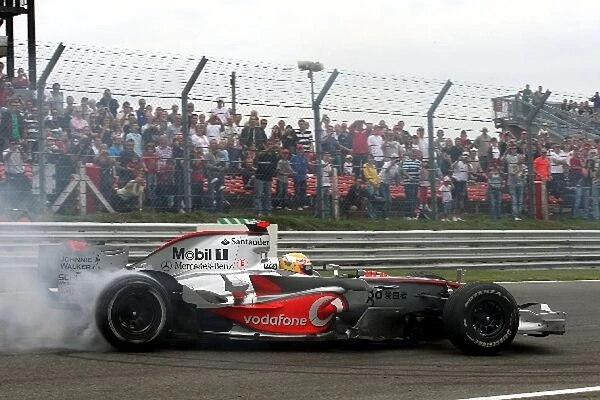DTM: Lewis Hamilton does doughnuts for the crowd in a McLaren F1 car