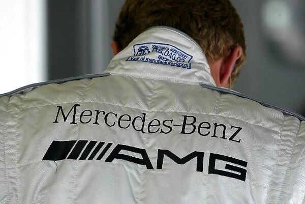 DTM: Mercedes-Benz AMG logo on the back of the overal of Marcel F├ñssler, AMG-Mercedes. DTM Championship, Rd 8, A1-Ring, Austria. 07 September 2003