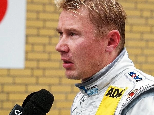 DTM: Mika Hakkinen AMG-Mercedes, is interviewed after qualifying second
