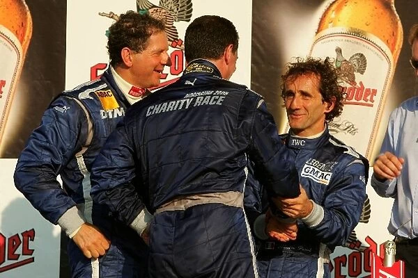 DTM Race of the Legends, Norisring: Podium, Nigel Mansell, congratulates Alain Prost, with his victory. Far left: Jody Scheckter. DTM Race of the Legends