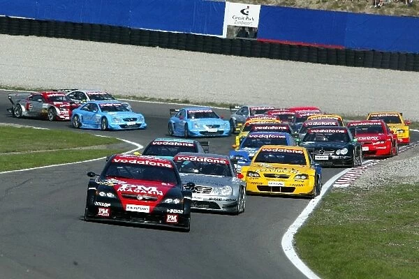 DTM: Start of the race with pole sitter Timo Scheider, OPC Team Phoenix, Opel Astra V8 Coupe, leading the field. DTM Championship, Rd9, Zandvoort, Holland