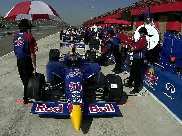 Eddie Cheever (USA), foreground, and team mate Tomas Scheckter (RSA), wait in the pit lane before practice for the Yamaha 400. Cheever and Scheckter qualified on pole and in 3rd