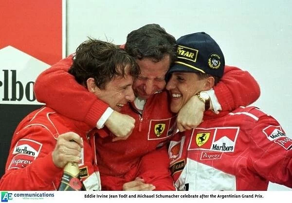 SE 8. Eddie Irvine Jean Todt and Michaael Schumacher celebrate after the