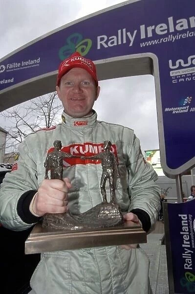 F5564. Eugene Donnelly (IRL) with the winner's trophy