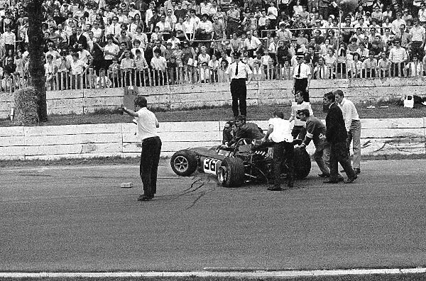 European Formula Two Championship: The Malcolm Guthrie Racing March 702 of Ronnie Peterson is removed from the circuit following a crash in the