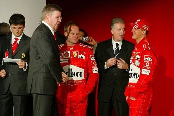 Ferrari Launch: Michael Schumacher Ferrari F2004 talks with Piero Lardi Ferrari Vice-President of Ferrari and Rubens Barrichello Ferrari F2004