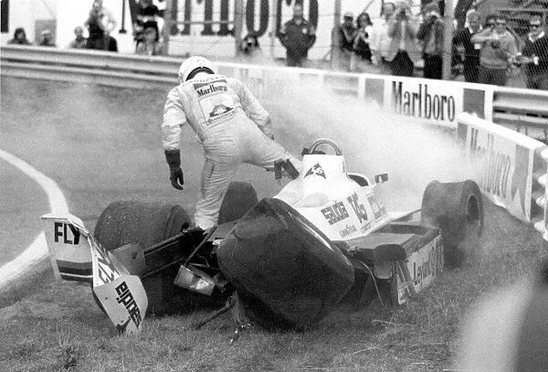 FIA Formula One World Championship 1980 Dutch Grand Prix, Zandvoort, Netherlands Alan Jones (Williams) Climbs from the wreck of his car. World Copyright: LAT Photographic. ref: 60mb B&W Scan