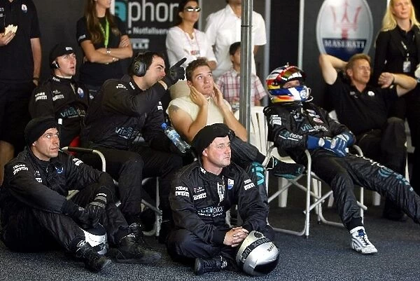 FIA GT Championship: The Vitaphone Racing crew watch the race with drivers Timo Scheider and Fabio Babini