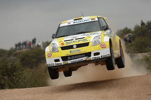 FIA World Rally Championship: Aaron Burkart Suzuki SX4 WRC on stage 4