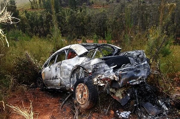 FIA World Rally Championship: The burnt out shell of the Peugeot 307 WRC of Daniel Carlsson with co-driver Matthias Andersson after crashing