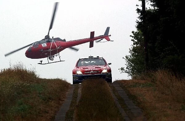 FIA World Rally Championship: Carlos Sainz  /  Marc Marti Citroen Xsara WRc is filmed by the ISC helicopter on Stage 10